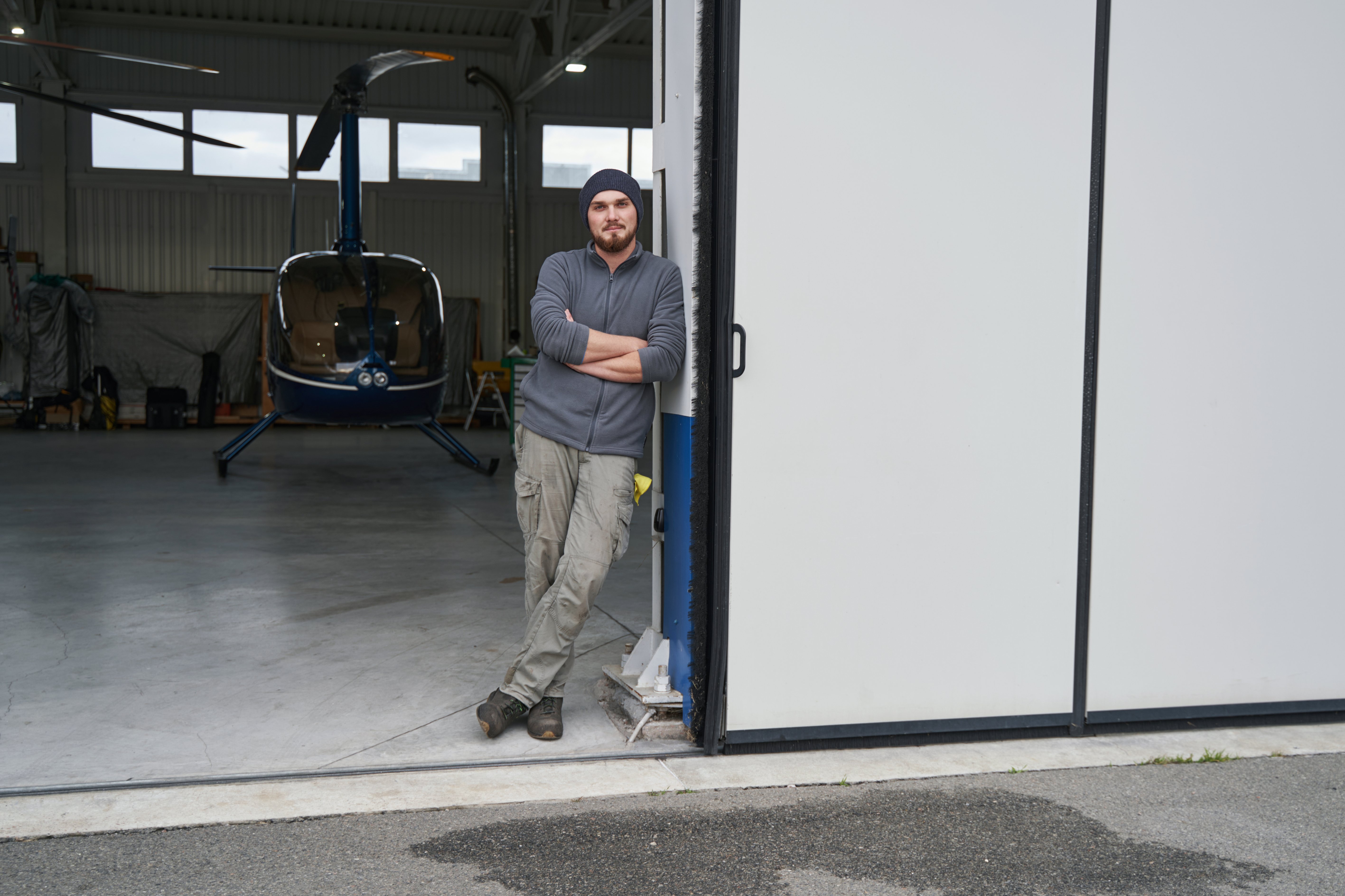 male-mechanic-posing-isolated-in-copter-background-2022-02-02-19-26-12-utc