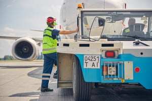 man-in-headphones-and-a-tug-driver-2021-09-03-21-02-52-utc
